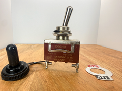 KN3C-101 toggle switch with rubber boot and ON/OFF plate on a wooden workbench