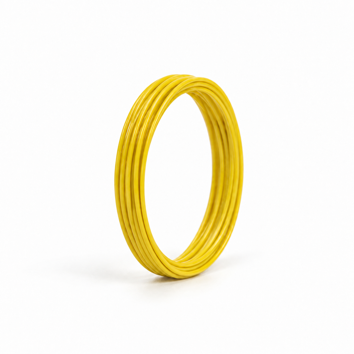 Yellow 5 m coil of fine 26 AWG PVC insulated hook-up wire, upright on a white background