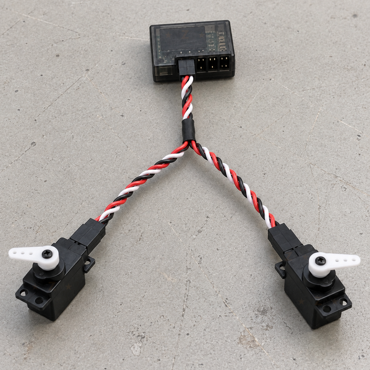 Futaba-style Y cable connecting one receiver channel to two RC servos