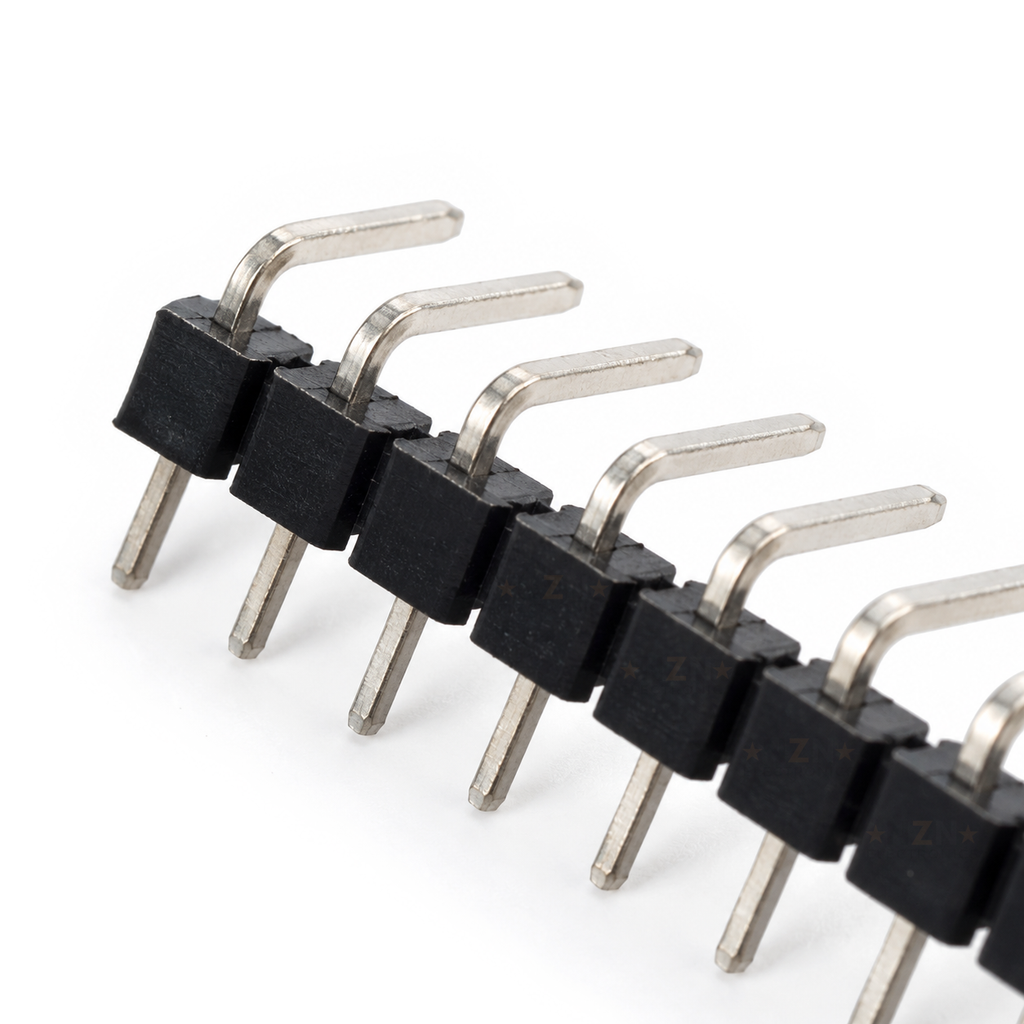 Close-up of the end of the right-angle header strip showing the 90 degree pin bends and the notches between blocks