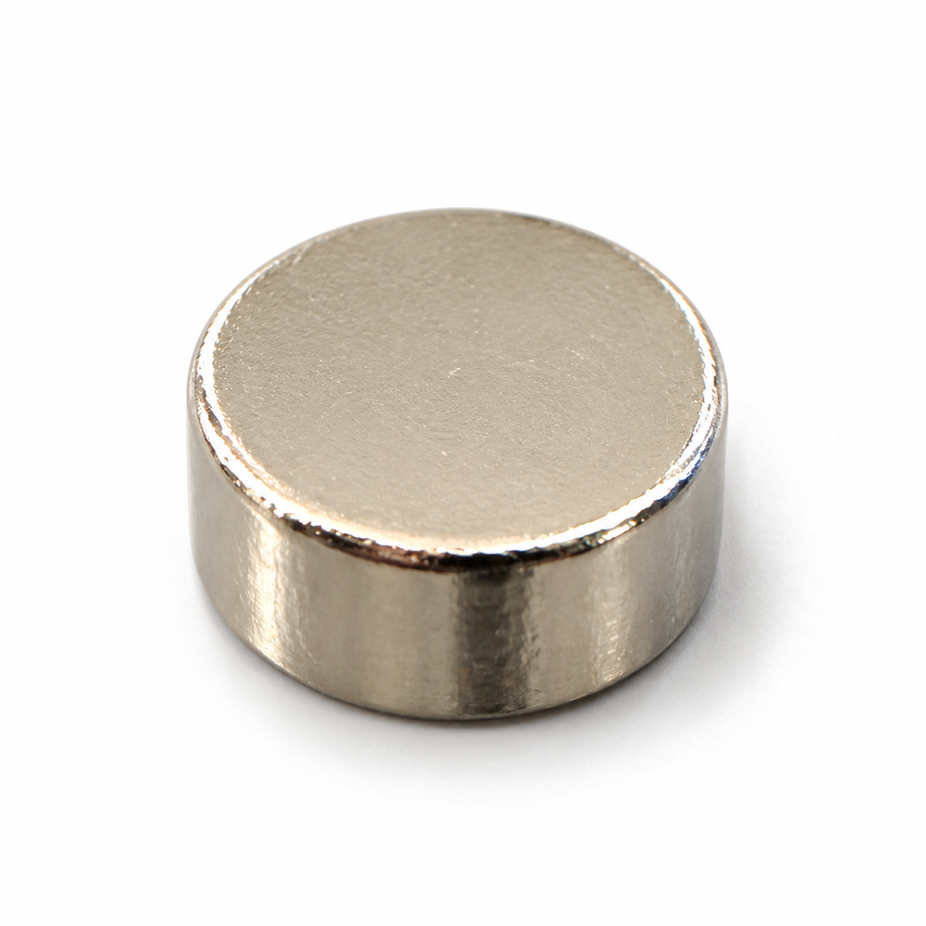 6 x 3 mm nickel-plated neodymium disc magnet lying flat, showing the top face and side