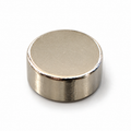 6 x 3 mm nickel-plated neodymium disc magnet lying flat, showing the top face and side