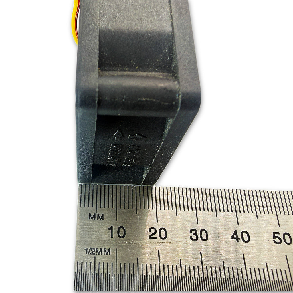 Sunon 4020 fan face-on with ruler confirming 40mm x 40mm dimensions