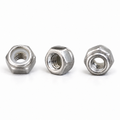 Three identical M3 304 stainless steel nylon insert lock nuts on white