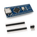 Unsoldered Nano V3 USB-C board with two loose 15-pin strips and one loose 2 by 3 ISP header