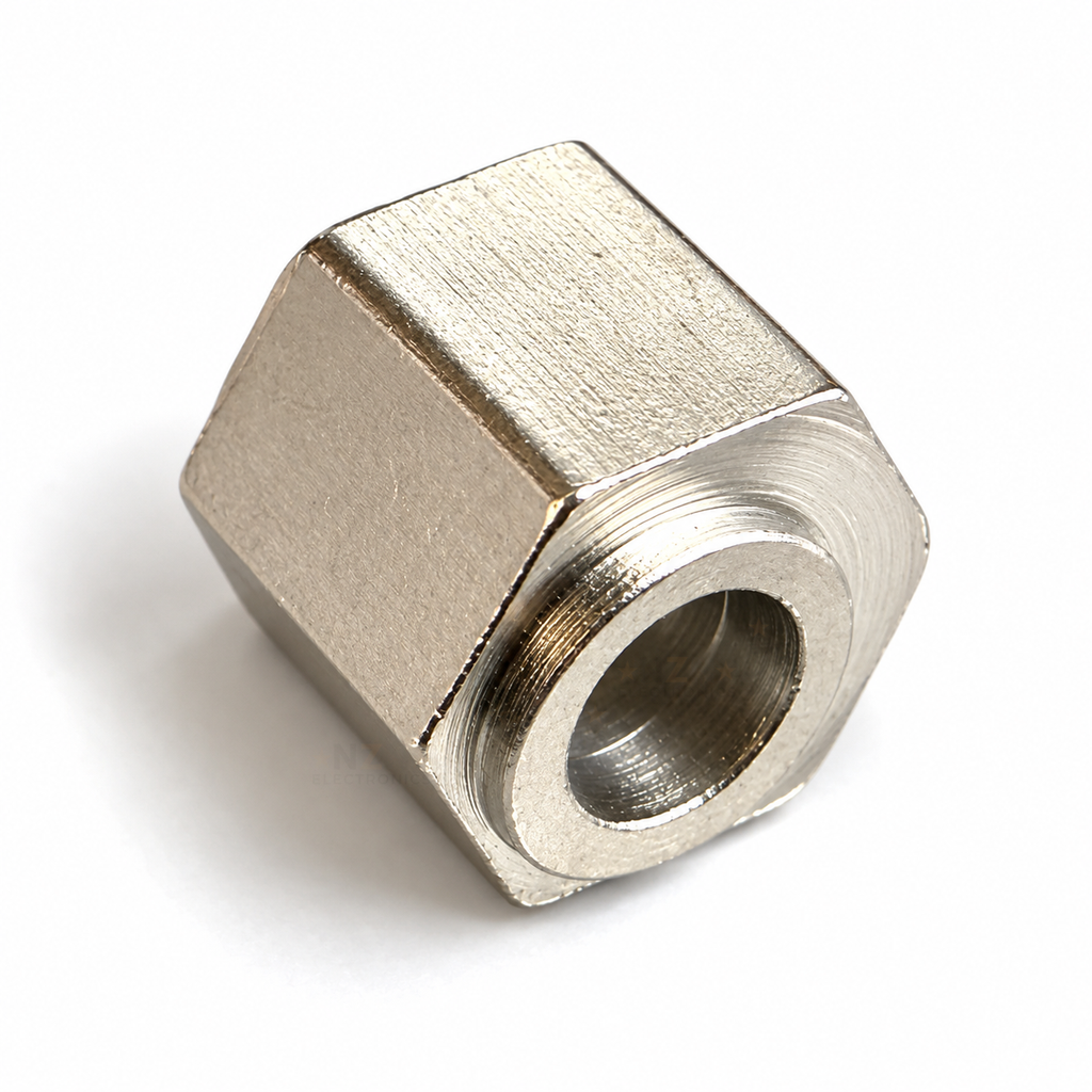 V-slot eccentric spacer lying on a hex face, boss end towards the camera with the 5mm bore visible