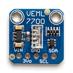Top view of the VEML7700 board showing pin labels VIN, 3Vo, GND, SCL and SDA, regulator and level-shift parts
