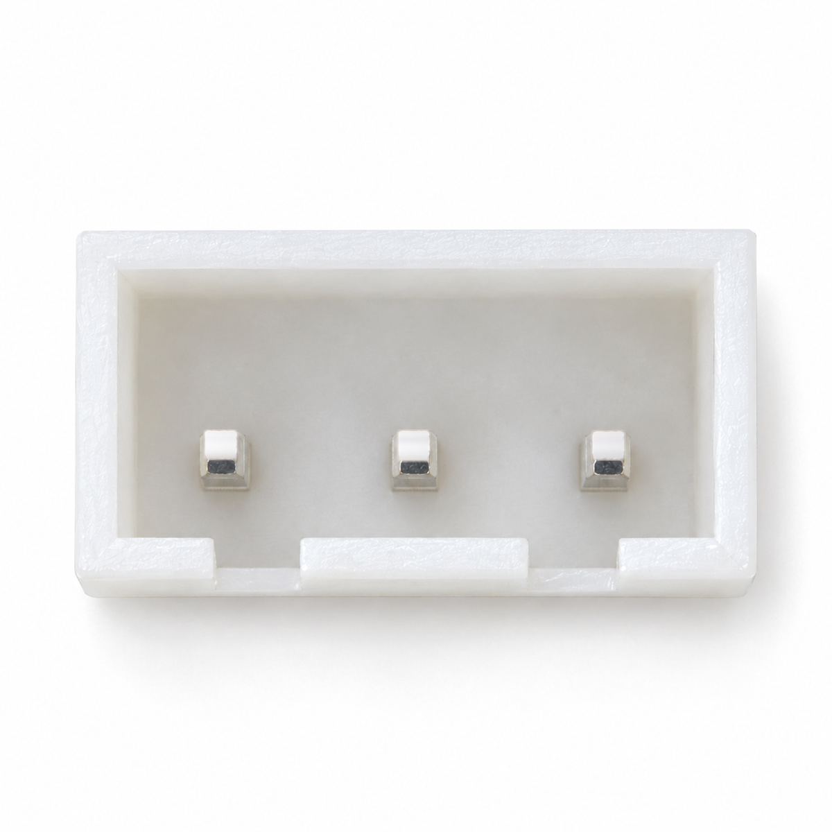 Top view into the XH 3-pin header showing the row of three square pins and the two latch slots